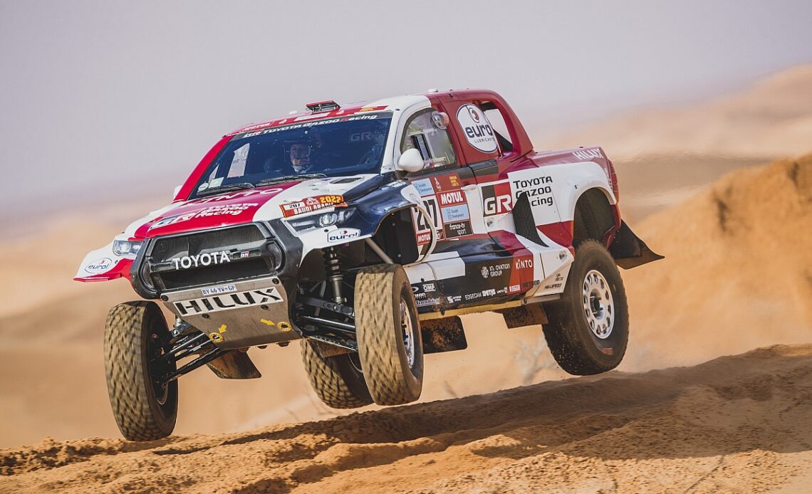 Toyota driver hit with Dakar penalty after collision with a bike rider