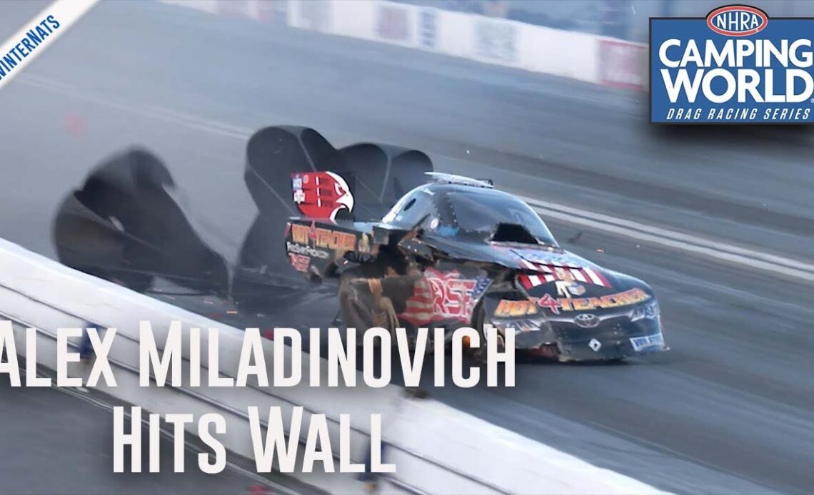 Alex Miladinovich takes a hard hit into the wall