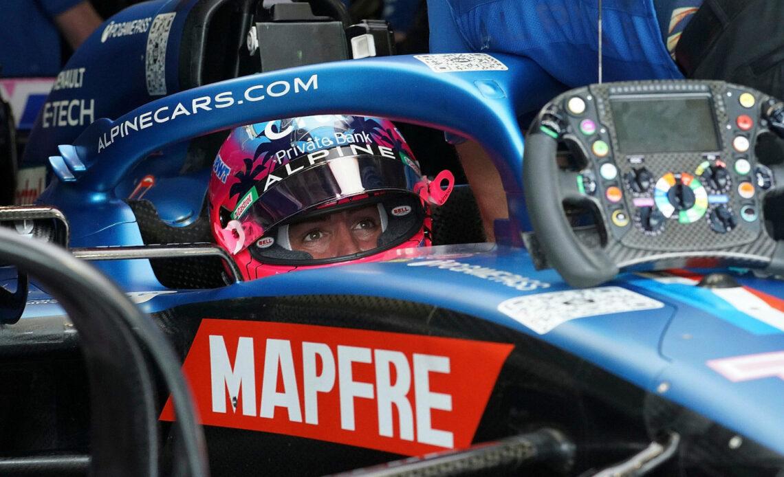 Fernando Alonso in his Alpine, steering wheel on the car