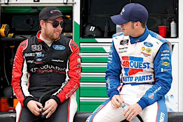 Chase Briscoe and Austin Cindric chat on pit road at Charlotte Motor Speedway. (Photo: NKP)