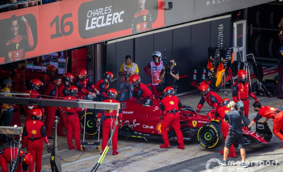 Charles Leclerc, Ferrari F1-75, is returned to the garage and retired from the race
