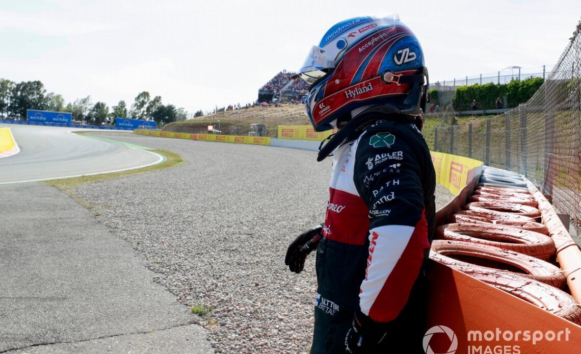 Valtteri Bottas, Alfa Romeo F1 Team, waits by a barrier