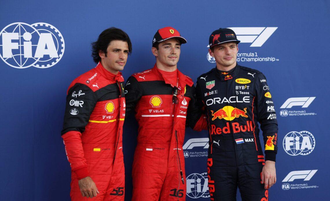 Pole position qualifier Charles Leclerc of Monaco and Ferrari (C), Second placed qualifier Carlos Sainz of Spain and Ferrari (L) and Third placed qualifier Max Verstappen of the Netherlands and Oracle Red Bull Racing (R) pose for a photo in parc ferme during qualifying ahead of the F1 Grand Prix of Miami at the Miami International Autodrome on May 07, 2022 in Miami, Florida. (Photo by Mark Thompson/Getty Images)