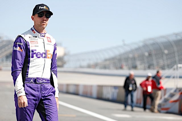 Denny Hamlin walks down pit road at Dover Motor Speedway. (Photo: NKP)