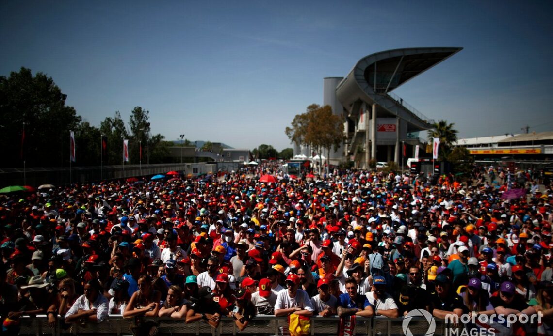 Fans watching Sebastian Vettel, Aston Martin AMR22 and Lance Stroll, Aston Martin AMR22, on stage