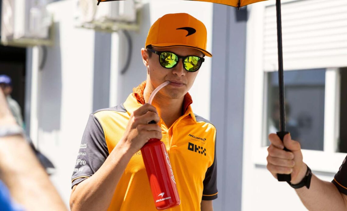 Lando Norris takes a drink. Barcelona May 2022.