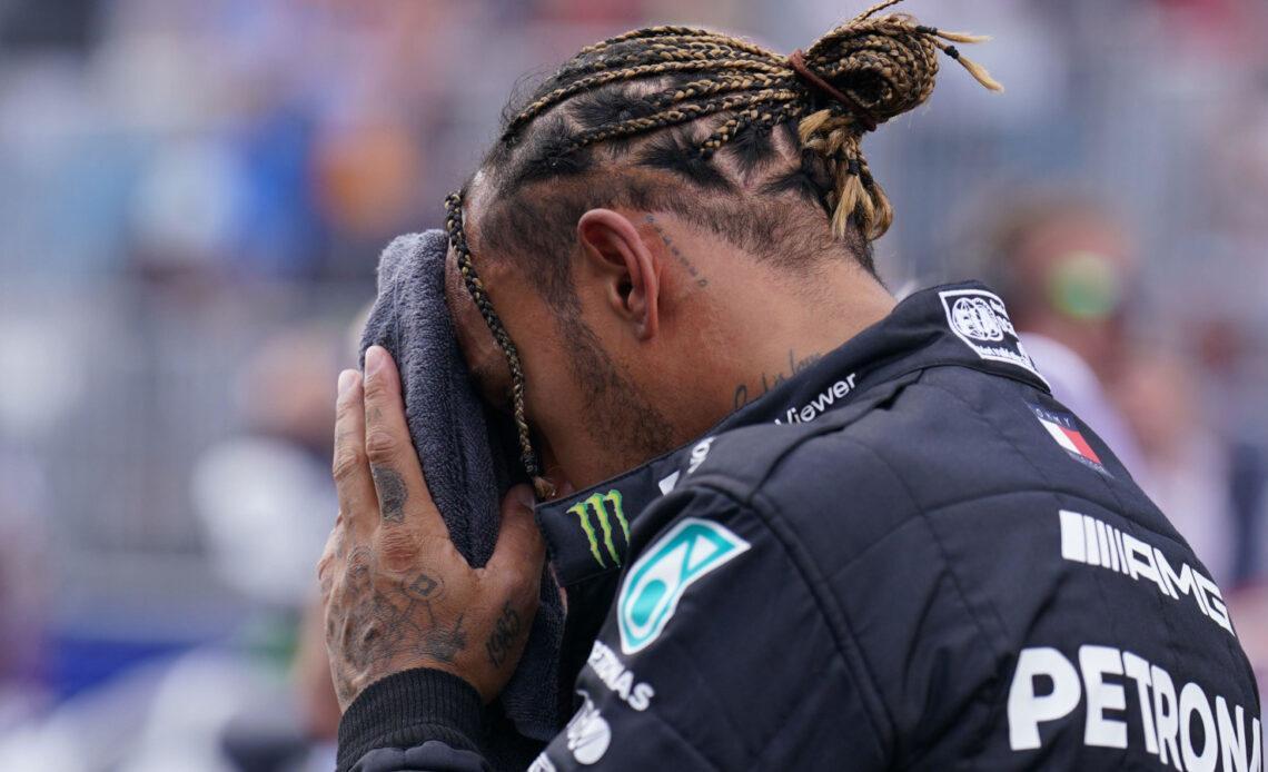 Lewis Hamilton with his face in a towel. Miami May 2022