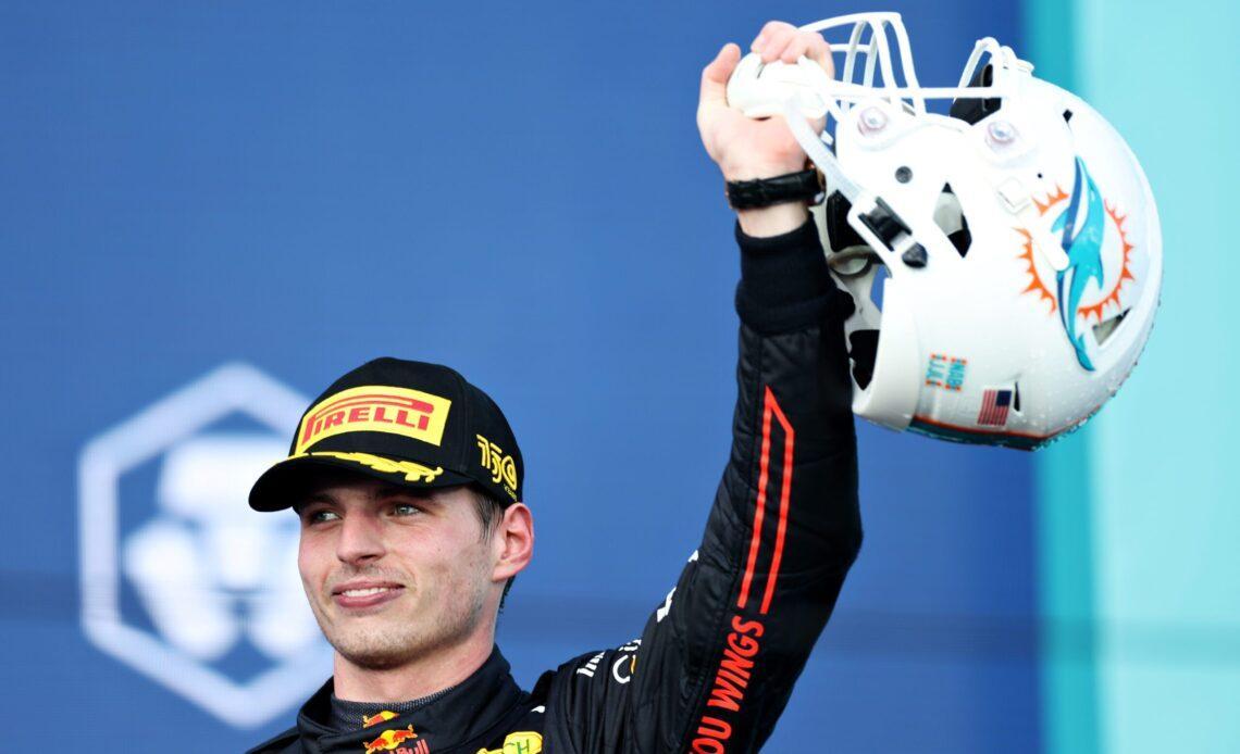 MIAMI, FLORIDA - MAY 08: Race winner Max Verstappen of the Netherlands and Oracle Red Bull Racing celebrates on the podium during the F1 Grand Prix of Miami at the Miami International Autodrome on May 08, 2022 in Miami, Florida. (Photo by Peter Fox/Getty Images)