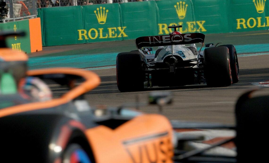 Daniel Ricciardo chasing George Russell. Miami May 2022