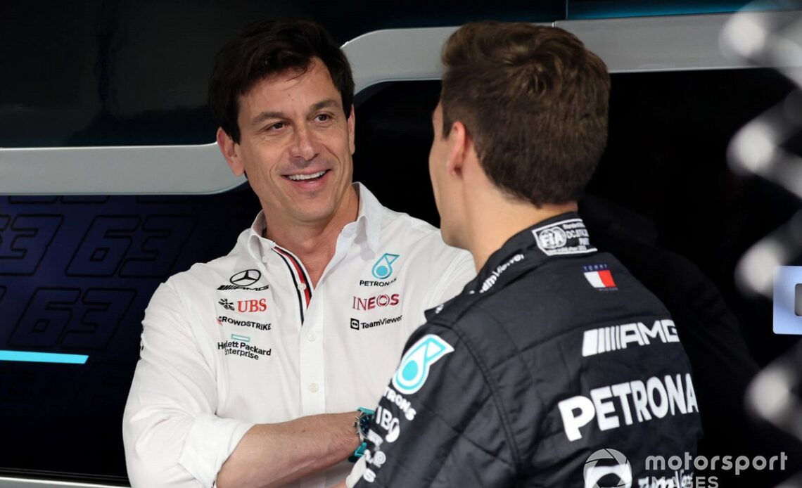 Toto Wolff, Team Principal and CEO, Mercedes AMG talks to George Russell, Mercedes-AMG in Mercedes garage
