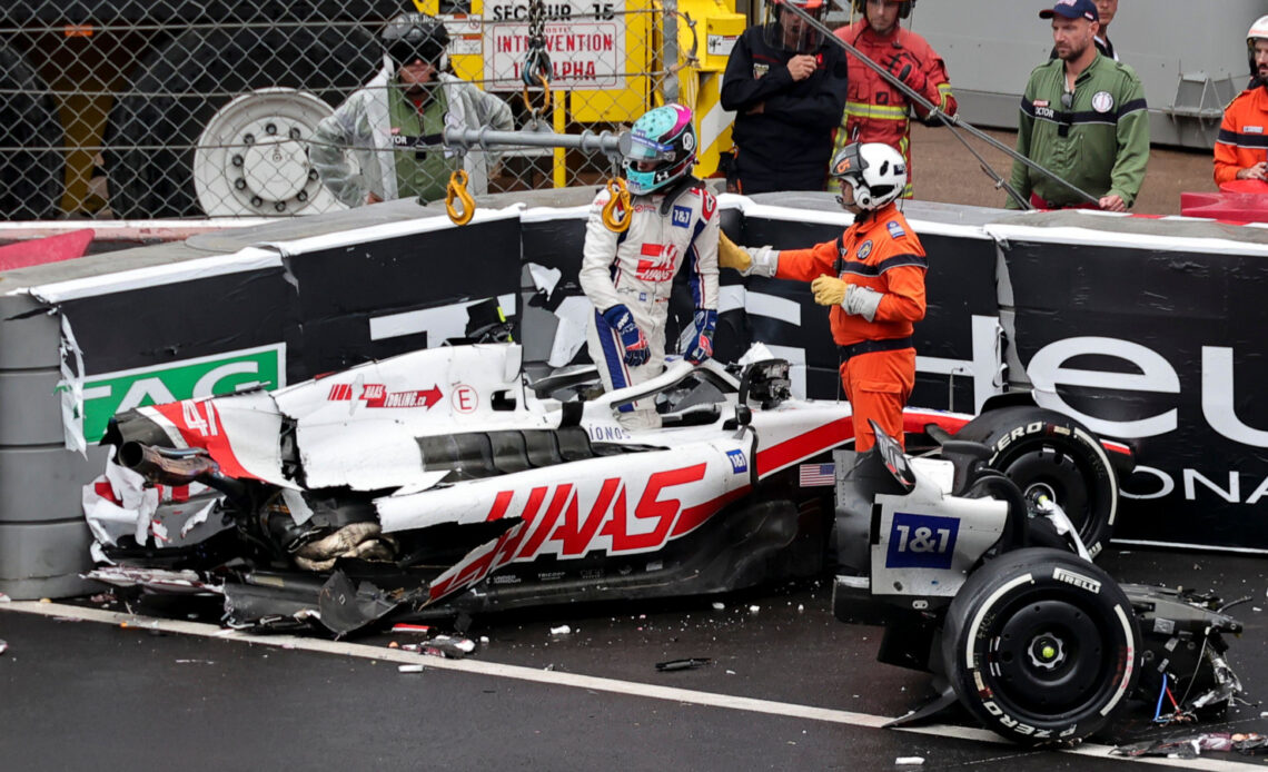 Mick Schumacher climbs from his wrecked Haas, rear missing. Monaco May 2022