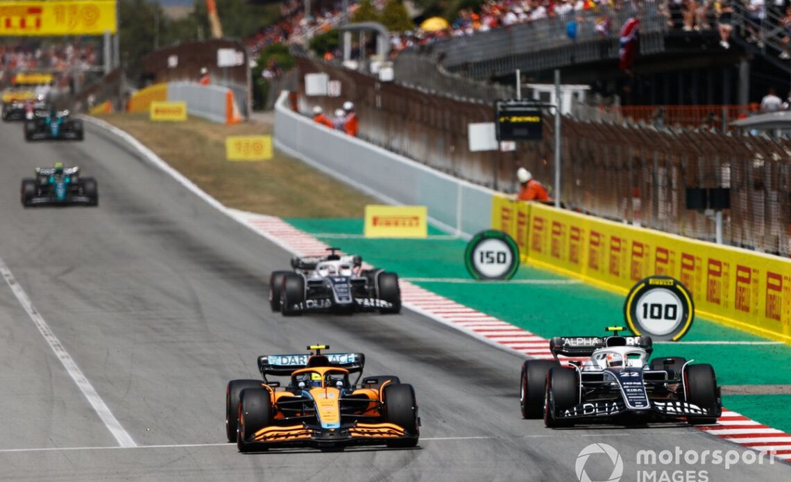 Lando Norris, McLaren MCL36, battles with Yuki Tsunoda, AlphaTauri AT03, ahead of Pierre Gasly, AlphaTauri AT03