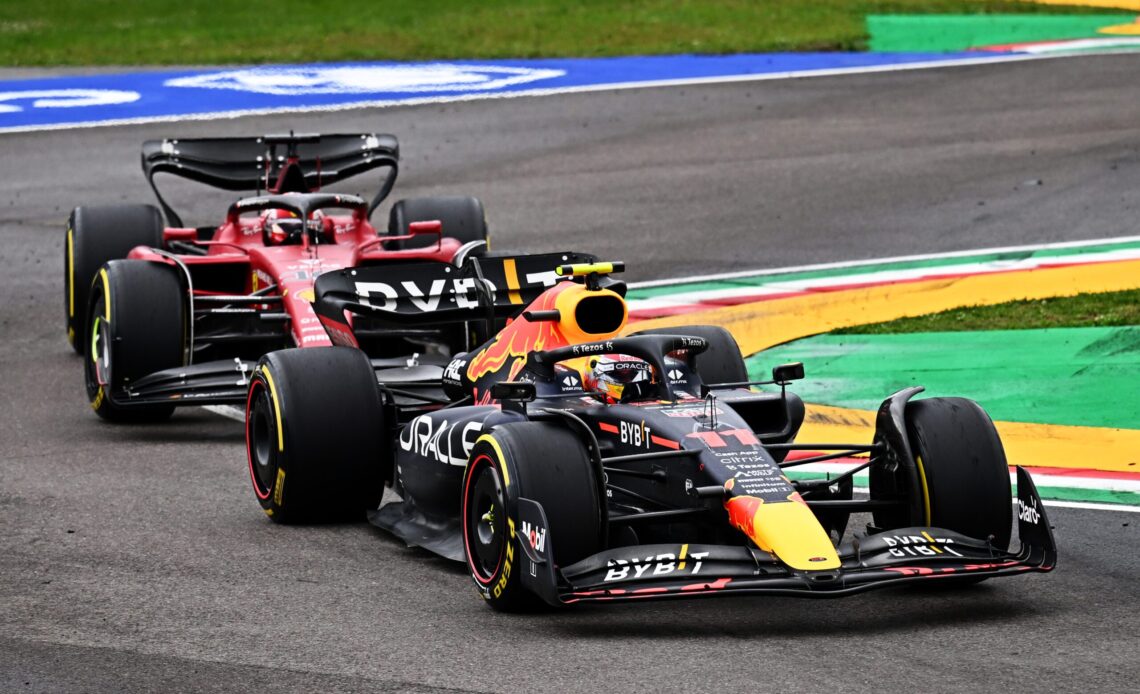 IMOLA, ITALY - APRIL 24: Sergio Perez of Mexico driving the (11) Oracle Red Bull Racing RB18 leads Charles Leclerc of Monaco driving (16) the Ferrari F1-75 during the F1 Grand Prix of Emilia Romagna at Autodromo Enzo e Dino Ferrari on April 24, 2022 in Imola, Italy. (Photo by Clive Mason/Getty Images) // Getty Images / Red Bull Content Pool // SI202204240595 // Usage for editorial use only //
