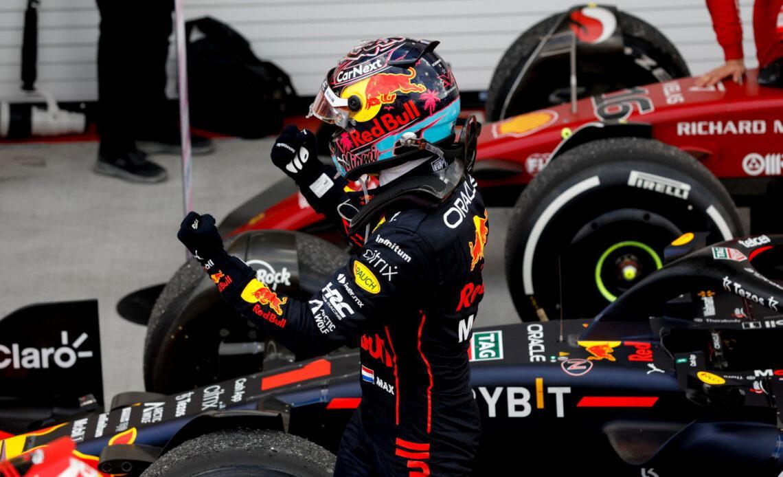 Max Verstappen celebrates his win, Ferrari in the background. Miami May 2022