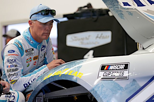 Kevin Harvick looks under the hood of his Stewart-Haas Racing Ford. Photo: NKP