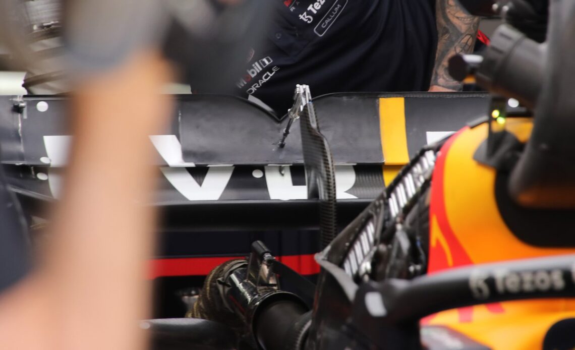 Mechanics work on the DRS of Max Verstappen, Red Bull RB18