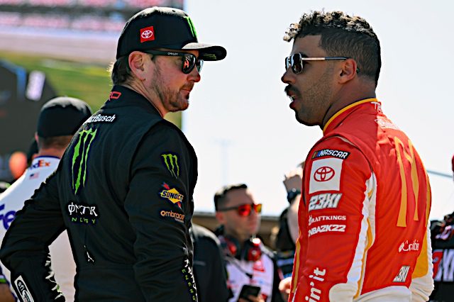 Kurt Busch and teammate Bubba Wallace discuss a NASCAR race at Talladega, 2022. Photo: NKP