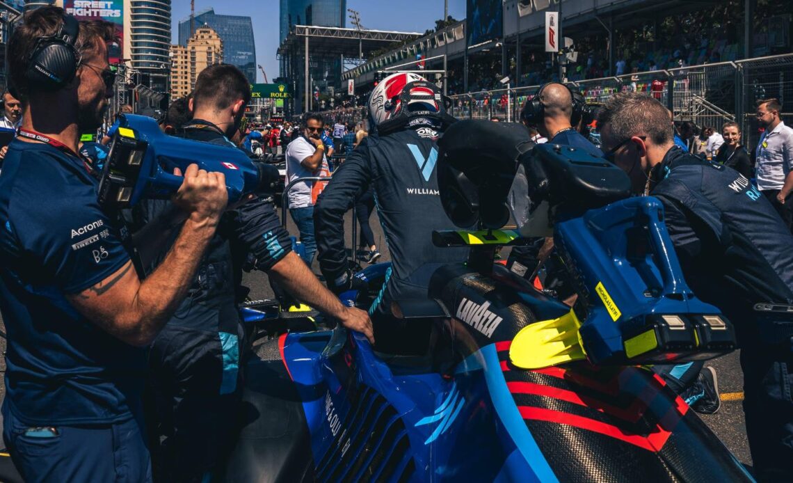 Nicholas Latifi climbs into the Williams FW44. Azerbaijan, June 2022.