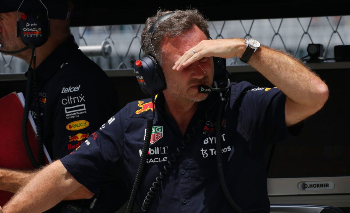 Christian Horner looks down the pit lane, Adrian Newey in the background. Miami May 2022