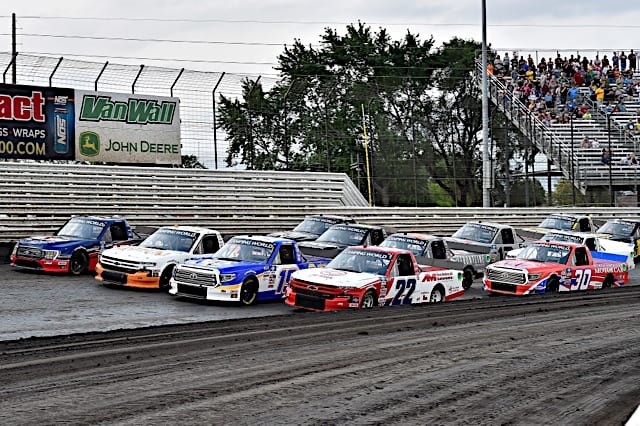 Trucks go out four wide before the start of the race at Knoxville, NKP