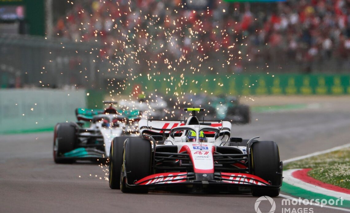 Mick Schumacher, Haas VF-22, George Russell, Mercedes W13, as sparks fly