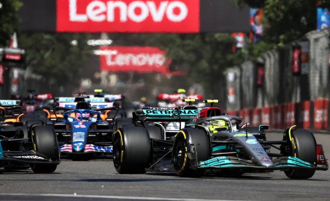 Lewis Hamilton heads a pack of cars. Baku June 2022.