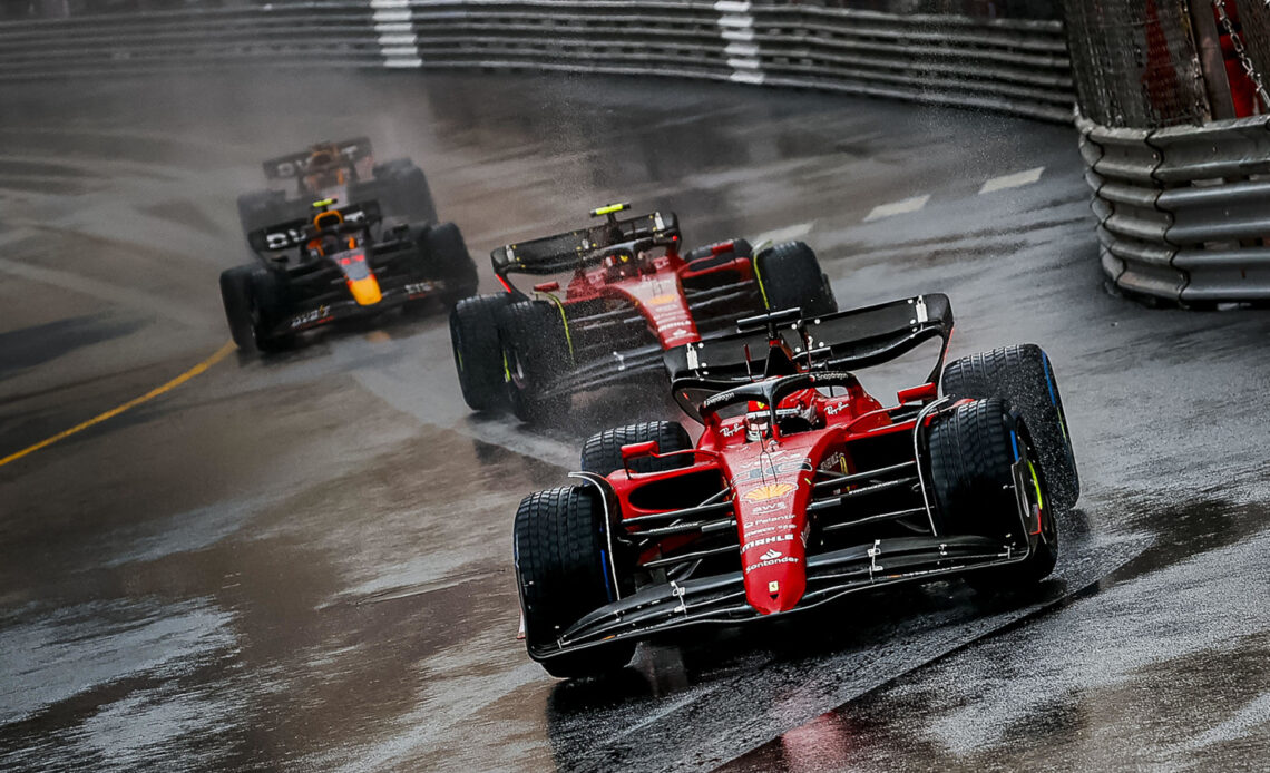 Charles Leclerc leads in the rain, running ahead of Carlos Sainz and the Red Bull drivers. Monaco May 2022