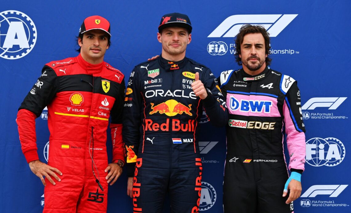 Pole position qualifier Max Verstappen of the Netherlands and Oracle Red Bull Racing (C), Second placed qualifier Fernando Alonso of Spain and Alpine F1 (R) and Third placed qualifier Carlos Sainz of Spain and Ferrari (L) pose for a photo in parc ferme during qualifying ahead of the F1 Grand Prix of Canada at Circuit Gilles Villeneuve on June 18, 2022 in Montreal, Quebec. (Photo by Dan Mullan/Getty Images)