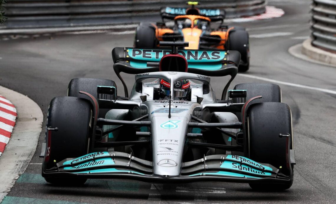 George Russell, Mercedes, ahead of Lando Norris, McLaren. Monaco, May 2022.