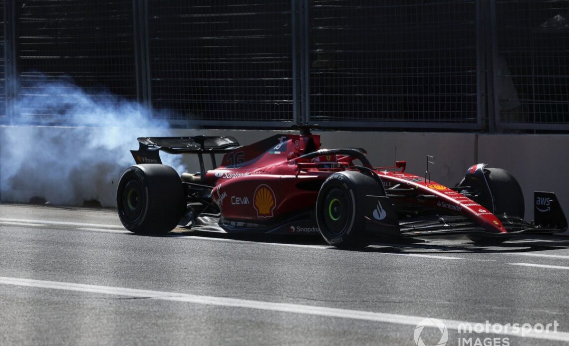 Charles Leclerc, Ferrari F1-75, limps back to the pit trailing smoke