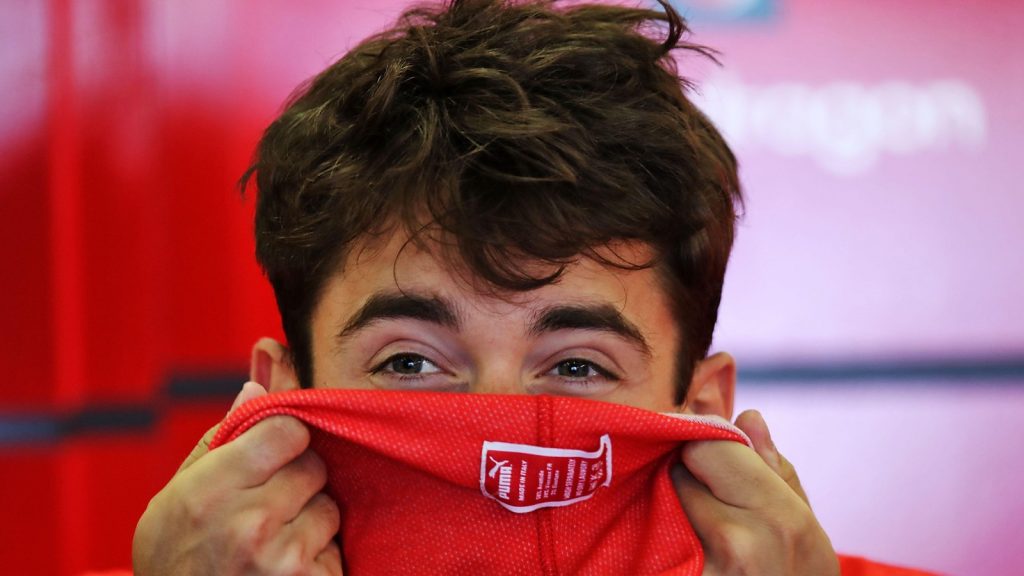 Charles Leclerc pulls on his fireproofs. Azerbaijan June 2022.