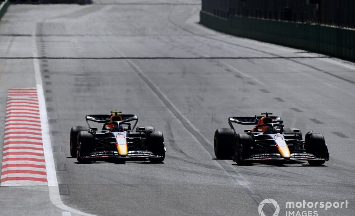 Max Verstappen, Red Bull Racing RB18, passes Sergio Perez, Red Bull Racing RB18