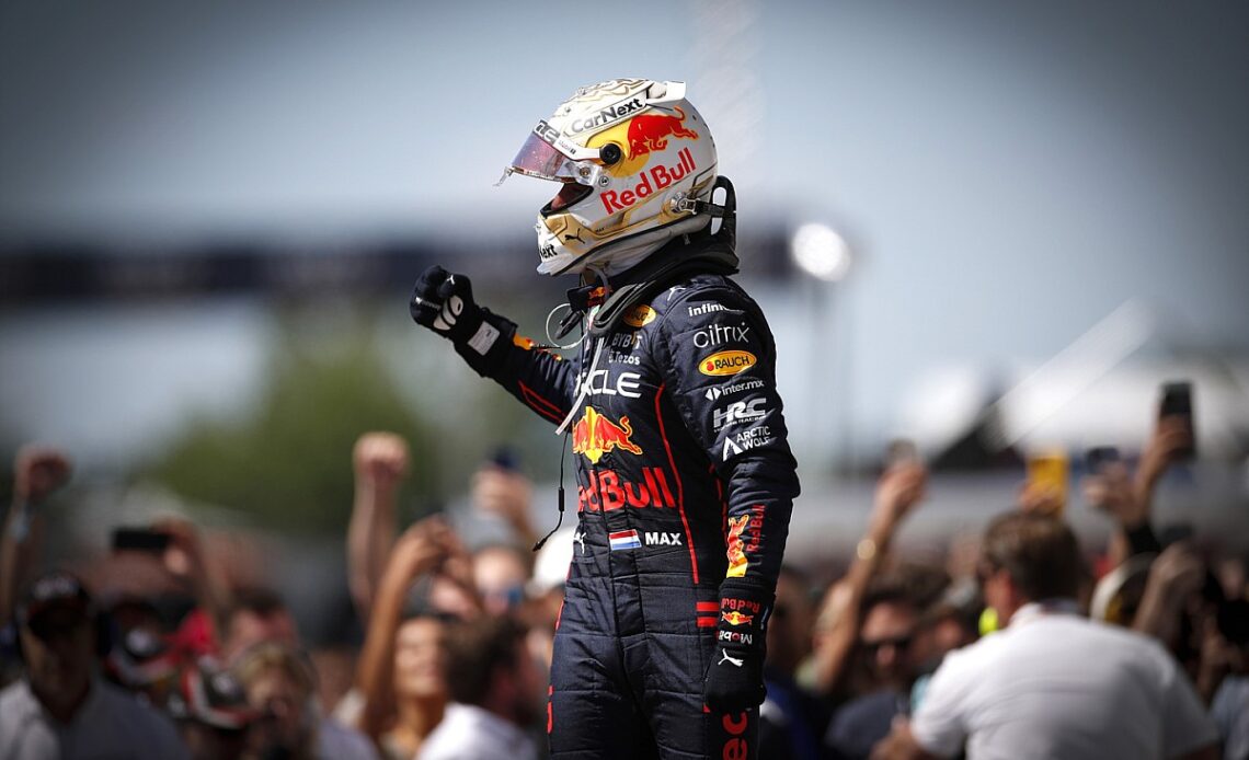 Verstappen holds off Sainz to win tense race