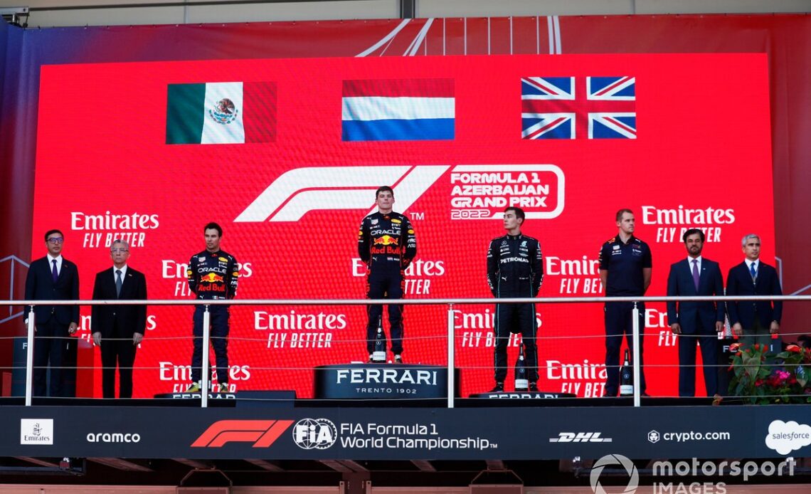 Sergio Perez, Red Bull Racing, 2nd position, Max Verstappen, Red Bull Racing, 1st position, George Russell, Mercedes-AMG, 3rd position, on the podium