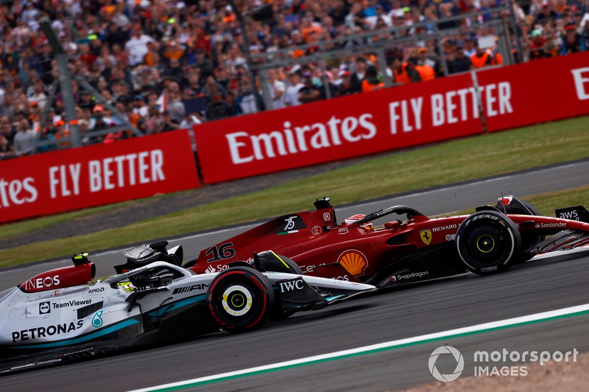 Charles Leclerc, Ferrari F1-75, battles with Lewis Hamilton, Mercedes W13