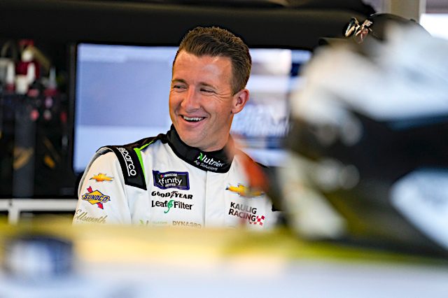 AJ Allmendinger laughs inside the NASCAR garage area at Daytona. (Photo: NKP)