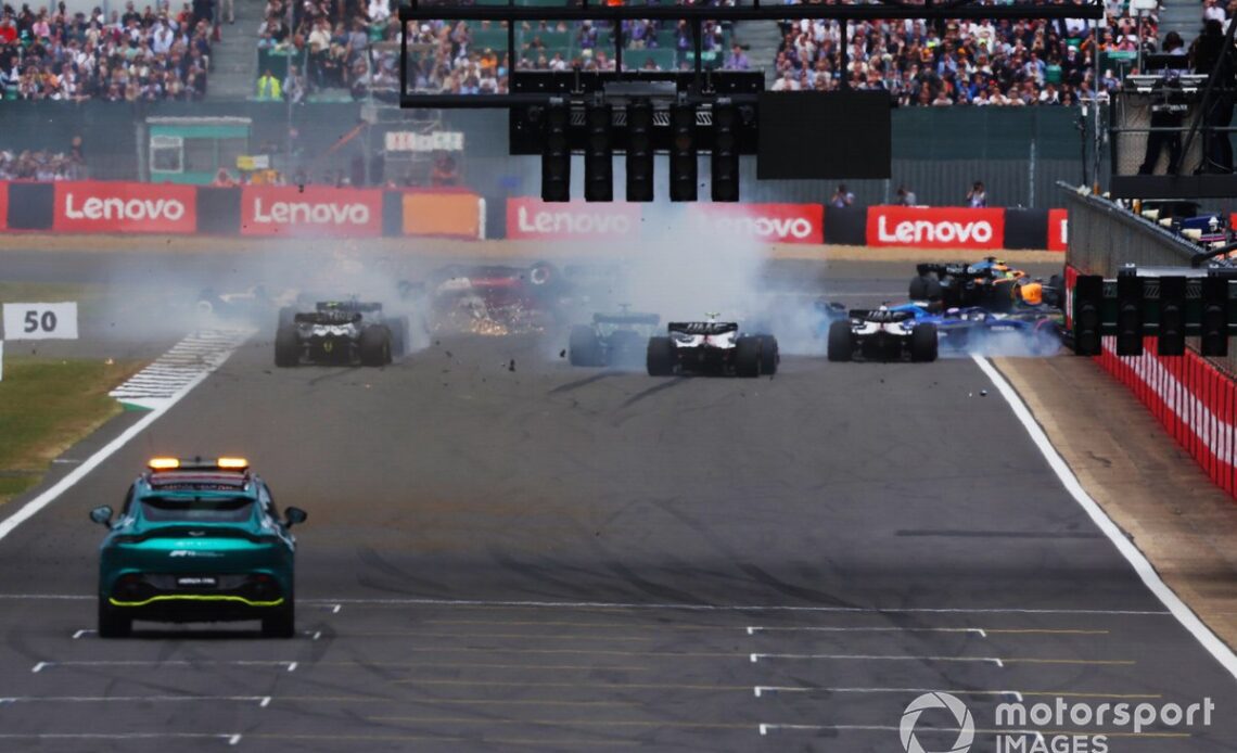 A rear view of the crash at the first start. Zhou Guanyu, Alfa Romeo C42, George Russell, Mercedes W13, Esteban Ocon, Alpine A522, Yuki Tsunoda, AlphaTauri AT03 and Alex Albon, Williams FW44 are involved