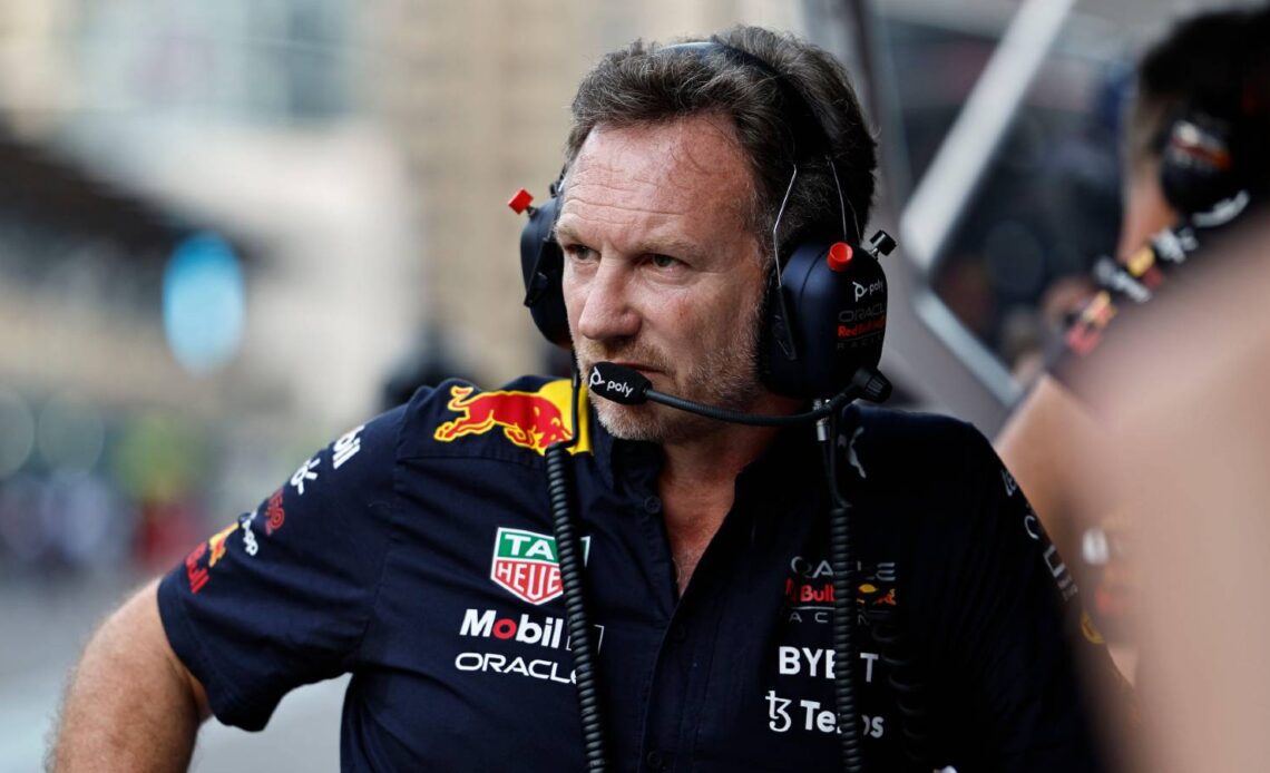 Christian Horner wearing headphones on the pit wall. Baku June 2022.