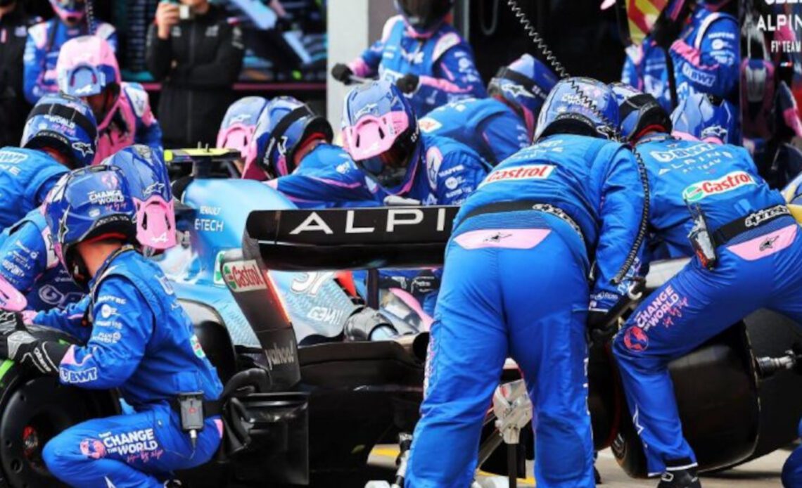 Esteban Ocon surrounded by his mechanics as he makes a pit stop. Imola April 2022