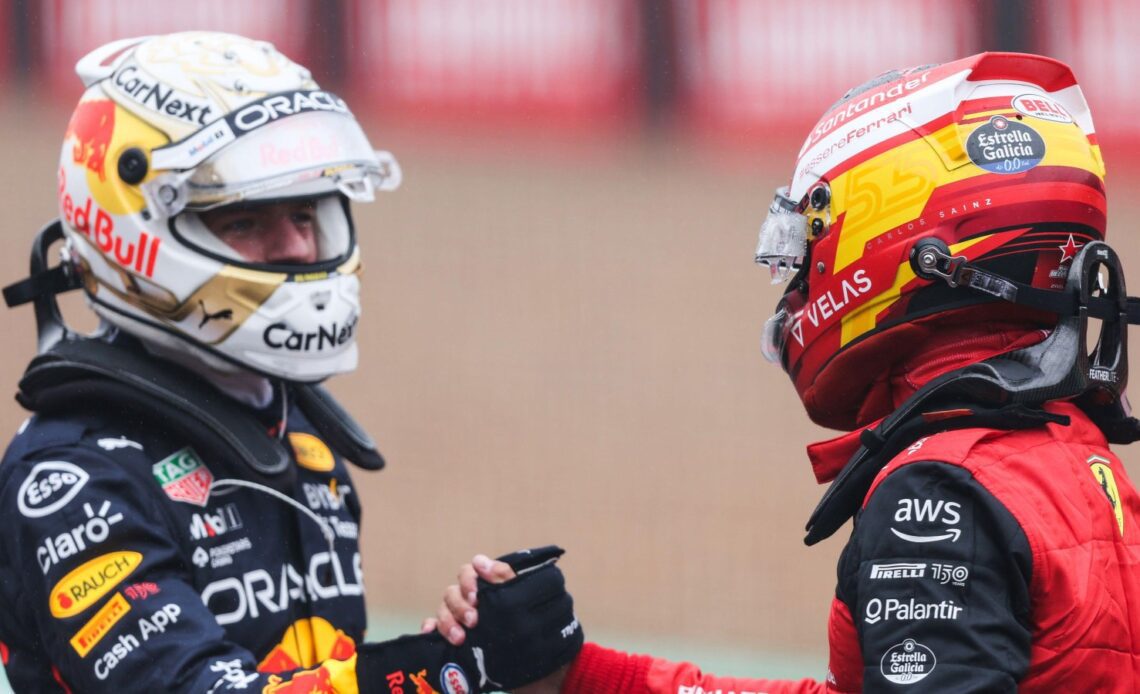 Max Verstappen and Carlos Sainz shake hands. Silverstone, July 2022.