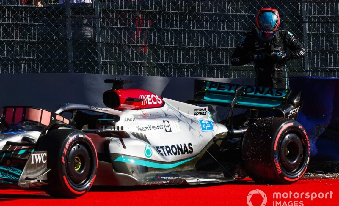 George Russell, Mercedes W13, gets out of his damaged car after crashing out in Q3
