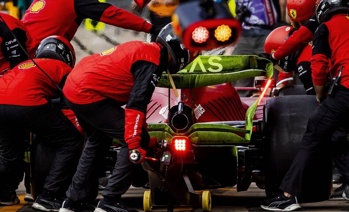 Mechanics work on the Ferrari of Charles Leclerc. England, July 2022.