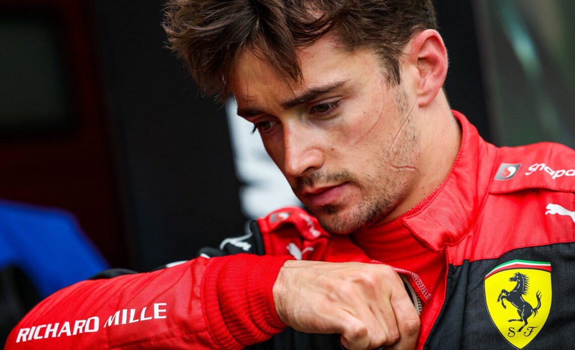 Charles Leclerc head down disappointed. Imola April 2022