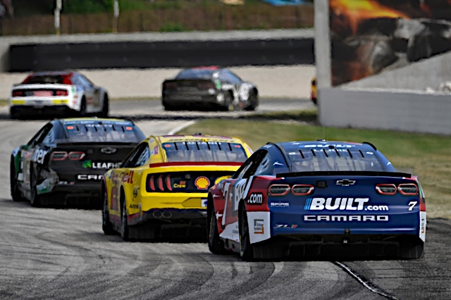 A pack of NASCAR race cars at Road America July 2022. Photo: NKP