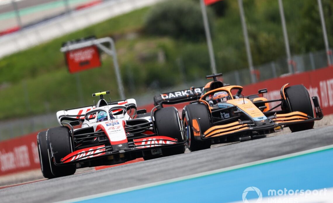 Daniel Ricciardo, McLaren MCL36, battles with Mick Schumacher, Haas VF-22