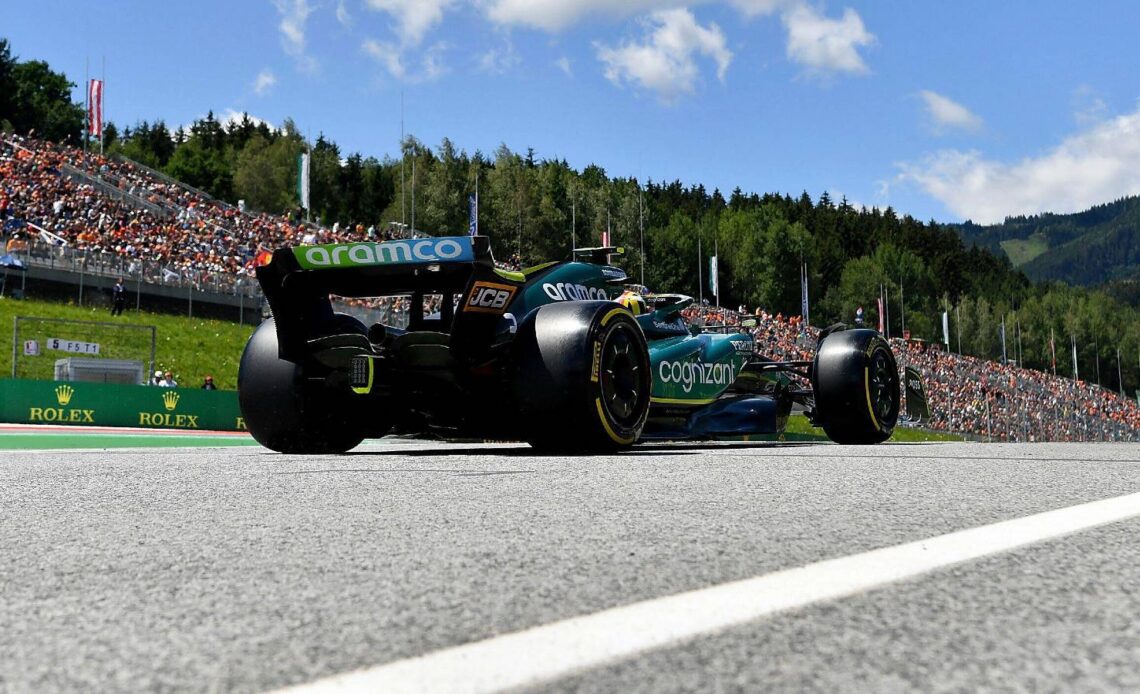 Sebastian Vettel, Aston Martin, pictured from ground level. Austria, July 2022.