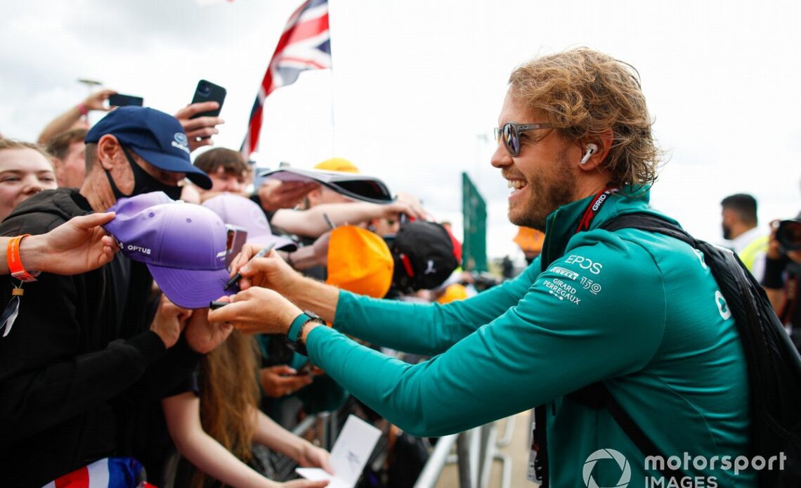 Sebastian Vettel, Aston Martin, signs autographs for fans