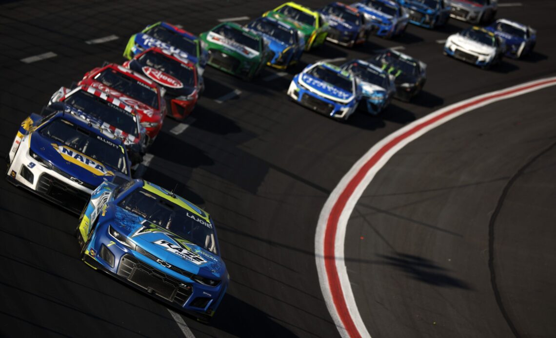 Corey LaJoie, driver of the #7 Raze Energy Chevrolet, leads the field during the NASCAR Cup Series Quaker State 400 at Atlanta Motor Speedway on July 10, 2022 in Hampton, Georgia. (Photo by Jared C. Tilton/Getty Images)