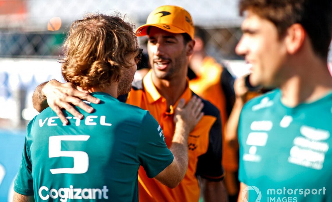 Daniel Ricciardo, McLaren, hugs Sebastian Vettel, Aston Martin