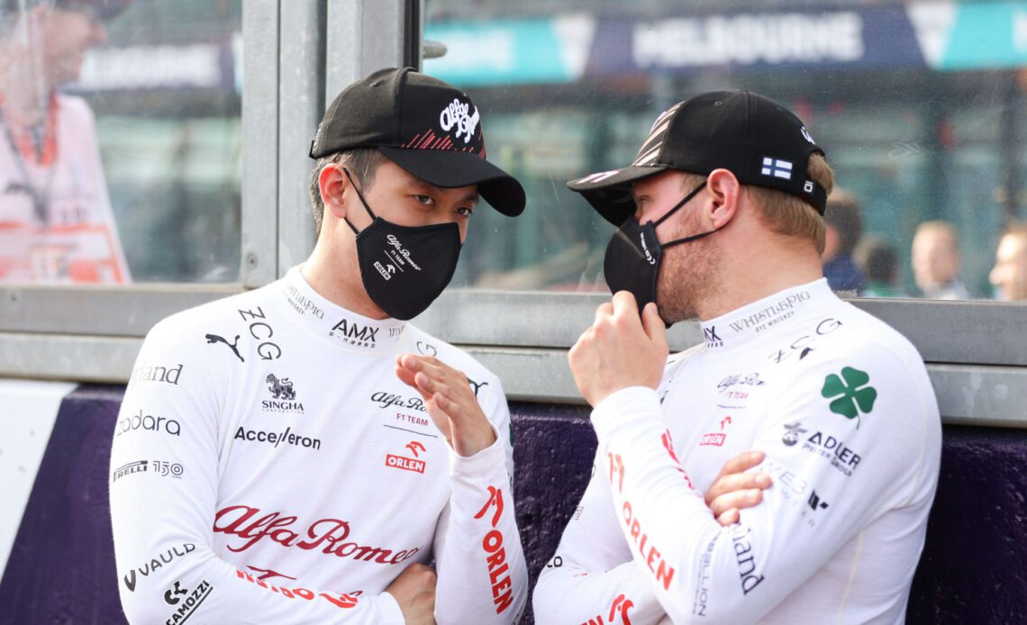 Alfa Romeo driver Guanyu Zhou explains to Valtteri Bottas. Australia April 2022